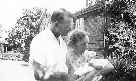 Picture of Sandra Lee Willis, age 6 weeks, held by grandmother Hilda G. Willis with grandfather L. Roy Willis, Sr. looking on, Easton, Maryland August 1941