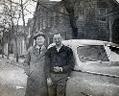 Picture of  L. Roy Willis, Sr. and L. Roy Willis, Jr. in front of new car on Harrison Street